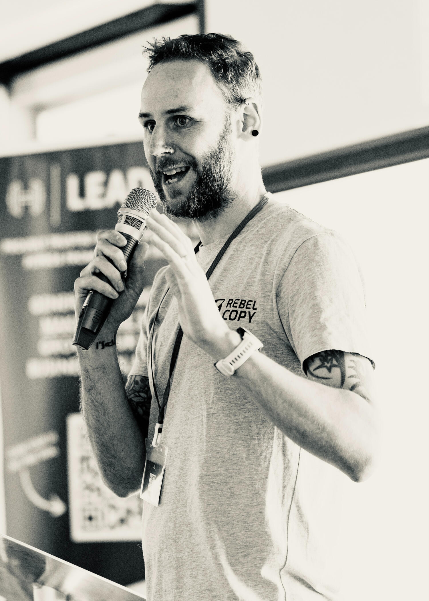 Al Clunnie Al Clunnie (Rebel Copy) speaking on stage at a copywriting event